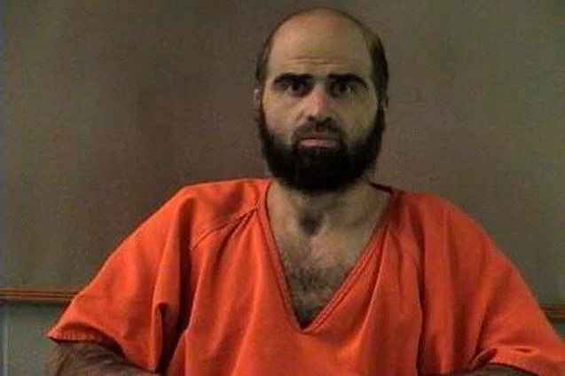 Nidal Hasan, charged with killing 13 people and wounding 31 in a November 2009 shooting spree at Fort Hood, is pictured in an undated handout photo. (Reuters)